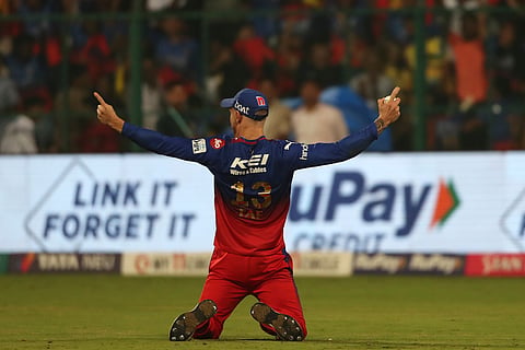 Royal Challengers Bengaluru's captain Faf du Plessis celebrates after taking the catch to dismiss Chennai Super Kings' Mitchell Santner during the Indian Premier League cricket match between Royal Challengers Bengaluru and Chennai Super Kings in Bengaluru, India, Saturday, May 18 , 2024. 


